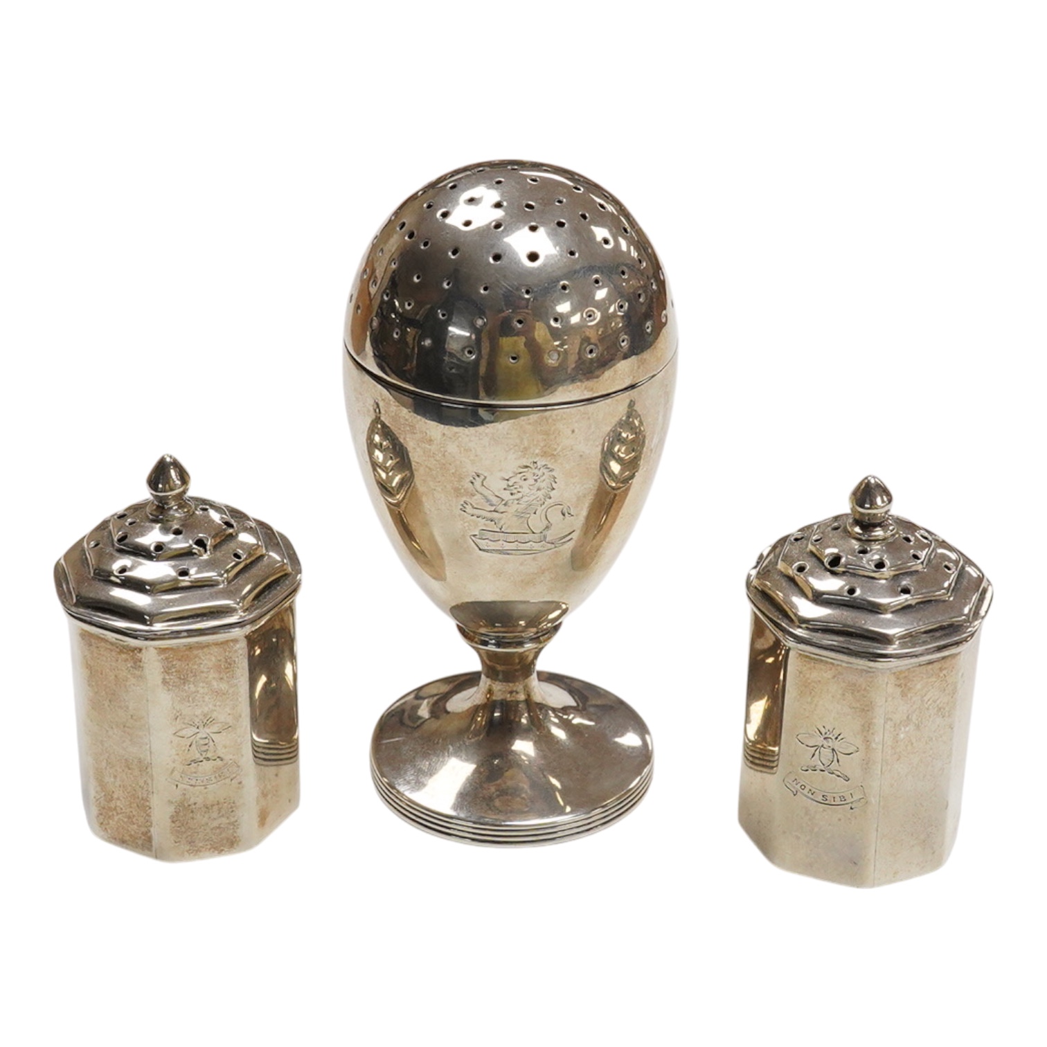 A George III provincial silver egg shaped pedestal pepperette, by Christian Ker Reid, Newcastle, circa, 1810, height 89mm, together with a pair of late Victorian octagonal pepperettes.